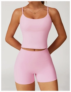 Detailed view of pink racerback yoga tank top with high elastic fabric and sleek texture