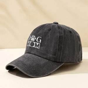 Close-up of DOG MOM embroidery with paw print on washed cotton baseball cap