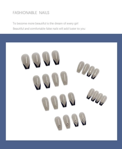 Detail of long trapezoid blue ombre press-on nails with silver glitter and rhinestones