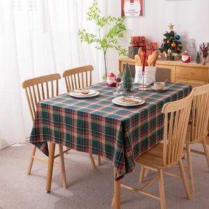 Classic red and green plaid Christmas tablecloth with tassels for festive dining decor