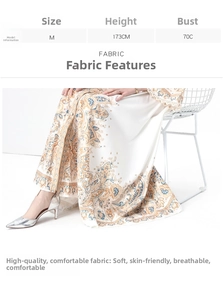 Detail of vintage paisley print on breathable soft white dress with baroque patterns