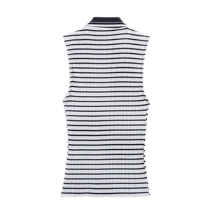 Detail of a slim-fit sleeveless polo top featuring black and white ribbed knit fabric
