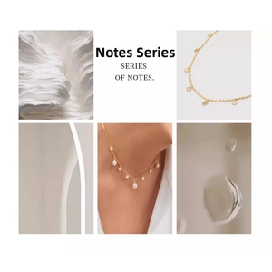 Detail of elegant gold necklace featuring freshwater pearls and tassel design accents