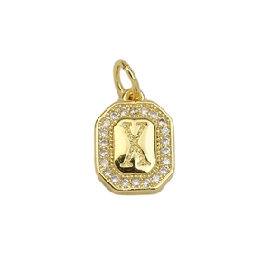 Detailed view of square gold pendant with letter X and sparkling zircon border