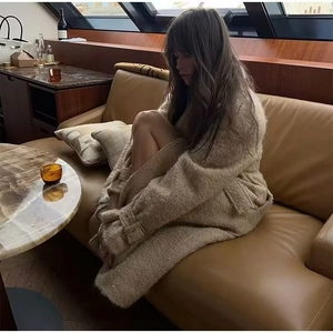 Elegant long camel faux fur coat for women with metal waist buckle and belted cuffs