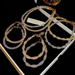 Braided gold and silver chain necklaces with zircons and lobster clasp closure