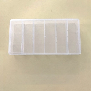 Detailed view of a transparent 6-compartment PP plastic storage box for small items