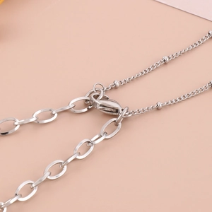 Double-layered oval silver chain necklace in polished 18K gold plated titanium steel