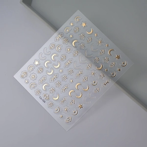 Detail of gold moon and star nail art stickers model Co-104 with metallic foil finish