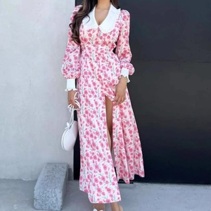 Detail of pink floral dress with large white doll collar and matching white cuffs