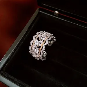 Luxury zircon hollow lace open ring with gold and silver plating on black velvet