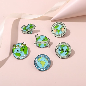 Detailed close-up of six eco-friendly enamel pins with Save the Earth slogans and themes