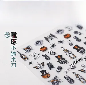 Macro view of Halloween nail stickers with pumpkins, skulls and bat patterns