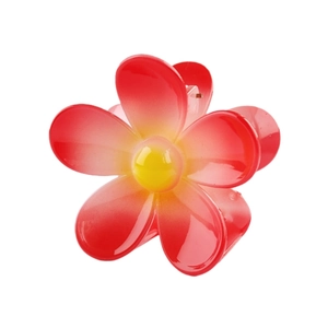Detailed view of flower hair claw clip with red and yellow gradient resin finish