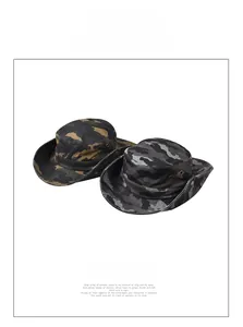 Detail of wide-brim camouflage sun hats in tan and grey with functional side metal snaps