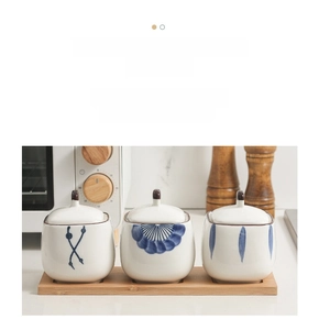 Japanese style ceramic seasoning jar set with blue floral patterns on wooden tray