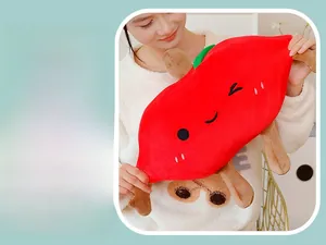 Detail of red apple plush toy showing the high elasticity and soft stretchable fabric