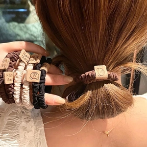 Set of high-elastic scrunchies with bear tags in coffee, cream, and black colors