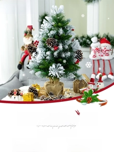 Detail of 60cm mini desktop snowy Christmas tree with pine cones and berries
