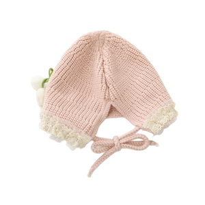 Pink knit baby hat with floral lace trim, plush ball detail and windproof ear flaps