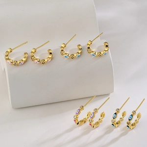 Golden C-shaped hoop earrings with micro-inlaid zircon and colorful evil eye enamel