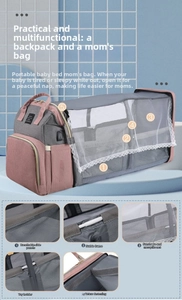 Pink and grey diaper bag with foldable crib feature and lace mosquito net cover