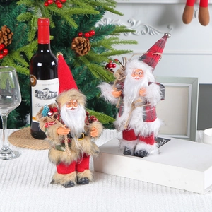 Set of two 9-inch standing Santa Claus figurines in a festive warm Christmas scene