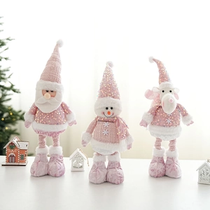 Pink sequin Christmas doll set with Santa, snowman and reindeer on festive background