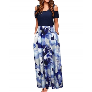 Detail of cold shoulder design and blue abstract floral print on the maxi dress