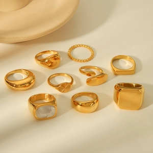 9-piece gold plated stainless steel ring set with geometric designs and shell inlay