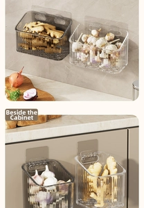 Close-up of wall-mounted kitchen storage bins with ripple texture for garlic and ginger