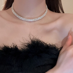 Close-up of double-row rhinestone choker necklace in silver on model's neck