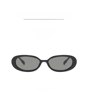 Detail shot of vintage oval sunglasses featuring black glossy frames and dark grey lenses