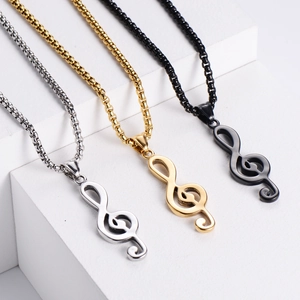 Minimalist treble clef music note necklaces in silver, gold, and black with bead chains