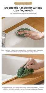 Detail of flexible green silicone kitchen brush showing ergonomic ring handle and bristles