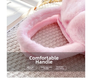 Close-up of pink faux fur kids bag showing plush handle and zipper detail