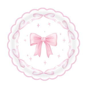 Pink bow birthday party set with scalloped paper plates and decorative patterns