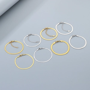 Detailed view of gold and silver snake chain bracelets with adjustable clasp options