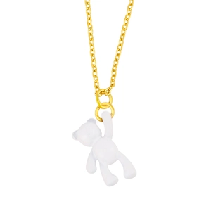 Detail view of a golden link necklace with a white bear pendant in glossy finish