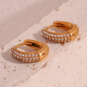 Detailed macro view of 18K gold plated mini pear shaped hoop earrings with pavé zircons