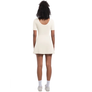 Back view of a creamy white tennis bodysuit dress with deep U-neck and A-line mini skirt
