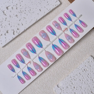 Short almond 3D floral press-on nails with pink to blue gradient and pink polka dots