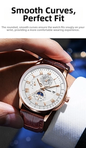 Close-up of rose gold business watch with moon phase and brown leather strap on wrist