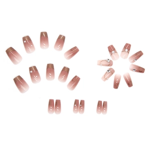 Elegant blush gradient press-on nails with pearls, heart charms, and gold leaf finish