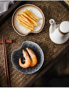 Top view of creative heart-shaped ceramic dessert plates with rustic stoneware textures