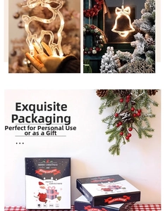 Close-up of warm white LED Christmas window lights with festive reindeer and bell gift box