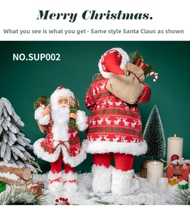 Detailed set of two Santa Claus figures in red knit outfits with reindeer patterns