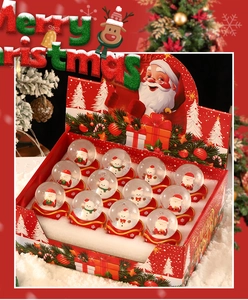 Detailed set of 12 mini Christmas snow globes featuring Santa Claus and Snowman figures