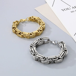 Detailed view of 15mm gold and silver Byzantine chain necklaces with lobster clasps