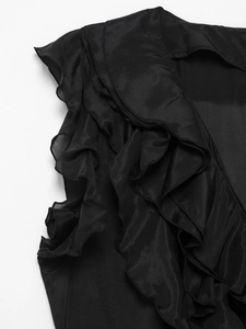 Detailed macro view of cascading tiered ruffles on a flowing black sleeveless maxi dress